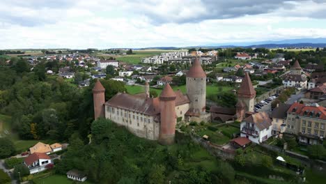 aerial view of a medieval castle in a swiss village