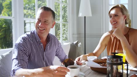 friends interacting while having breakfast