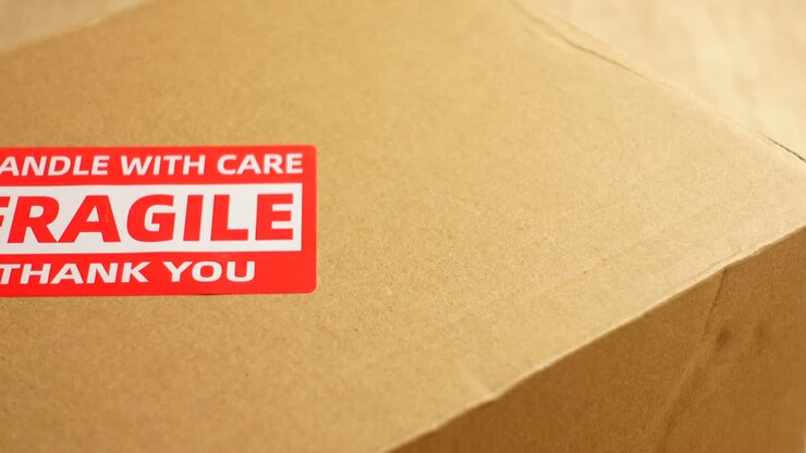 Cardboard box with fragile sticker
