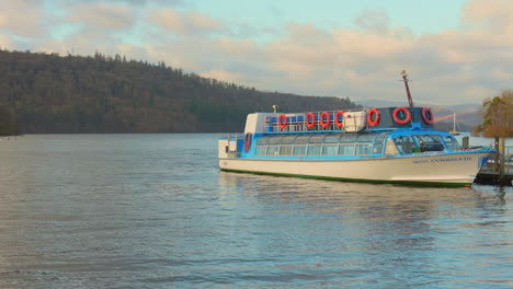 Profile-view-of-boat-parked-at-dock-area-on-lake-Windermere-in-the-Lake-District-of-Windermere,-England