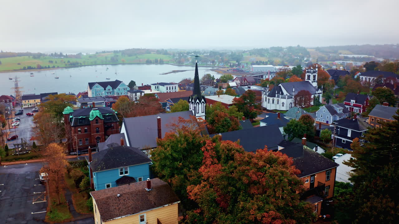 Aerial drone shot over the local town of Lunenburg in Nova Scotia, Canada. Fishing lobster town. Foggy misty day.
