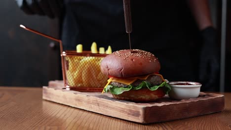 chef preparing a gourmet cheeseburger