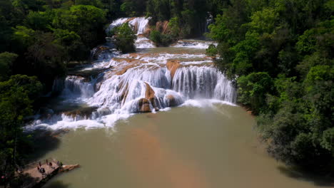 revealing drone shot of the cascadas de agua azul and the waterfalls found on the xanil river in chiapas mexico