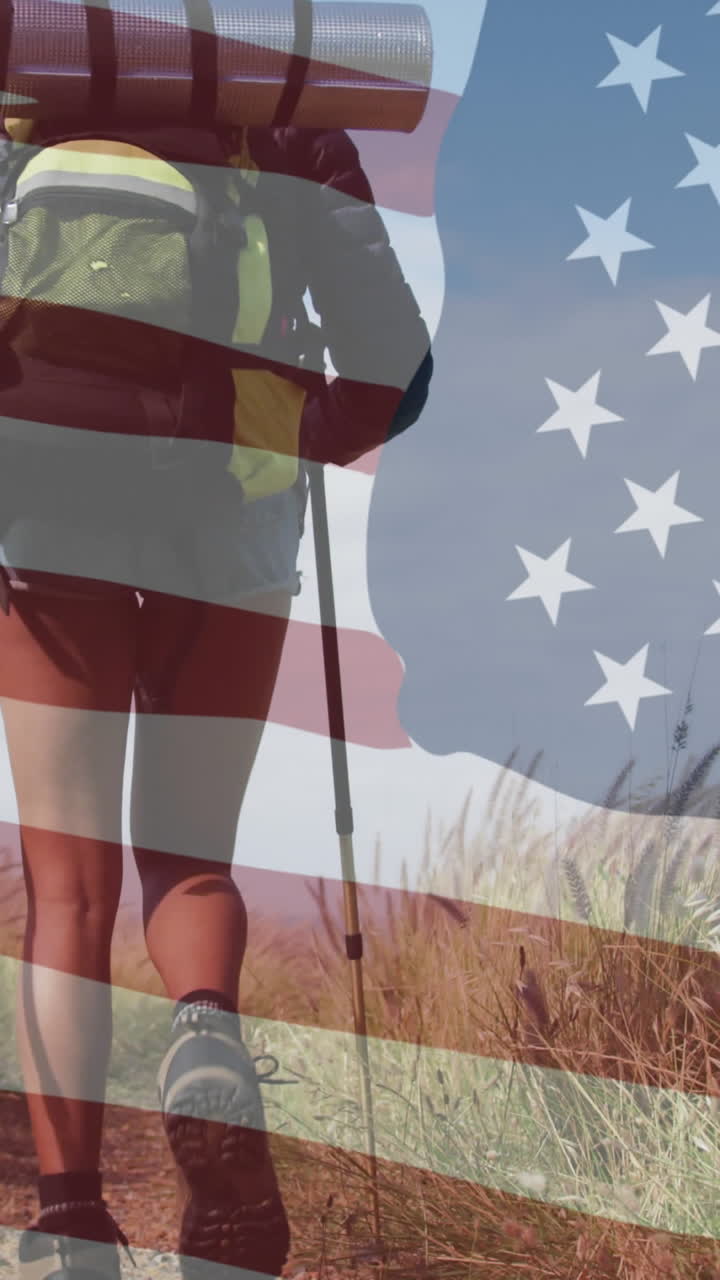 animación de la bandera estadounidense sobre una mujer biracial caminando por las montañas