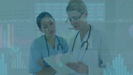two healthcare professionals reviewing patient data on clipboard, with digital charts overlaying