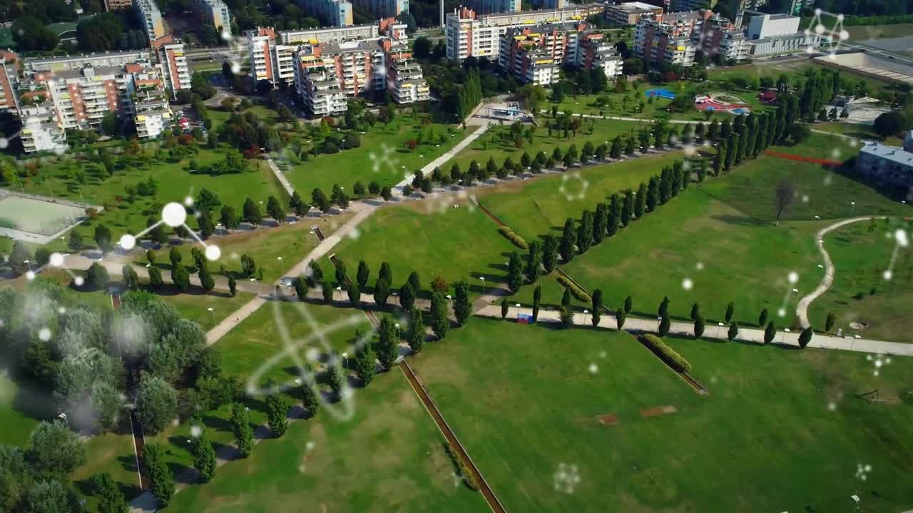 animación de conexiones que se mueven sobre vista aérea del parque y la ciudad moderna