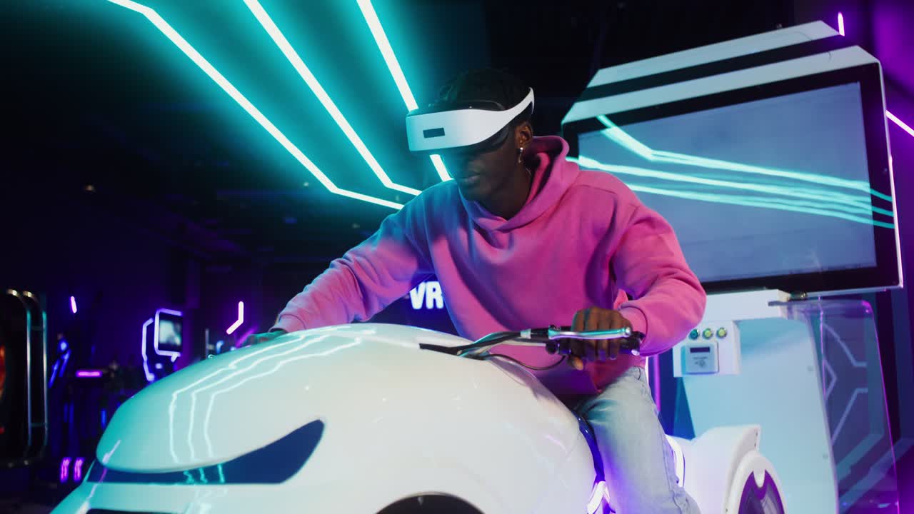 Man Experiencing Virtual Reality Gaming in Arcade