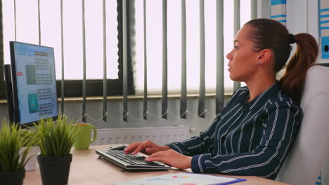 business woman typing on computer