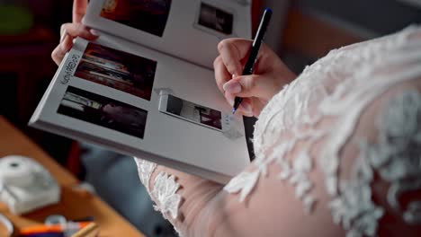 bride recording life’s precious memories of family and love in album