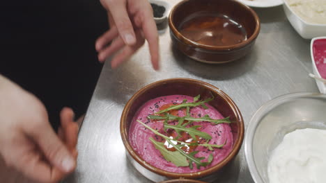 chef prepares mediterranean starter dish