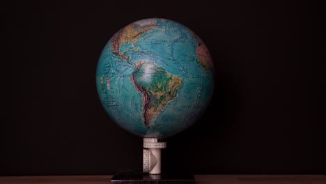 slow zoom in on south america on a globe