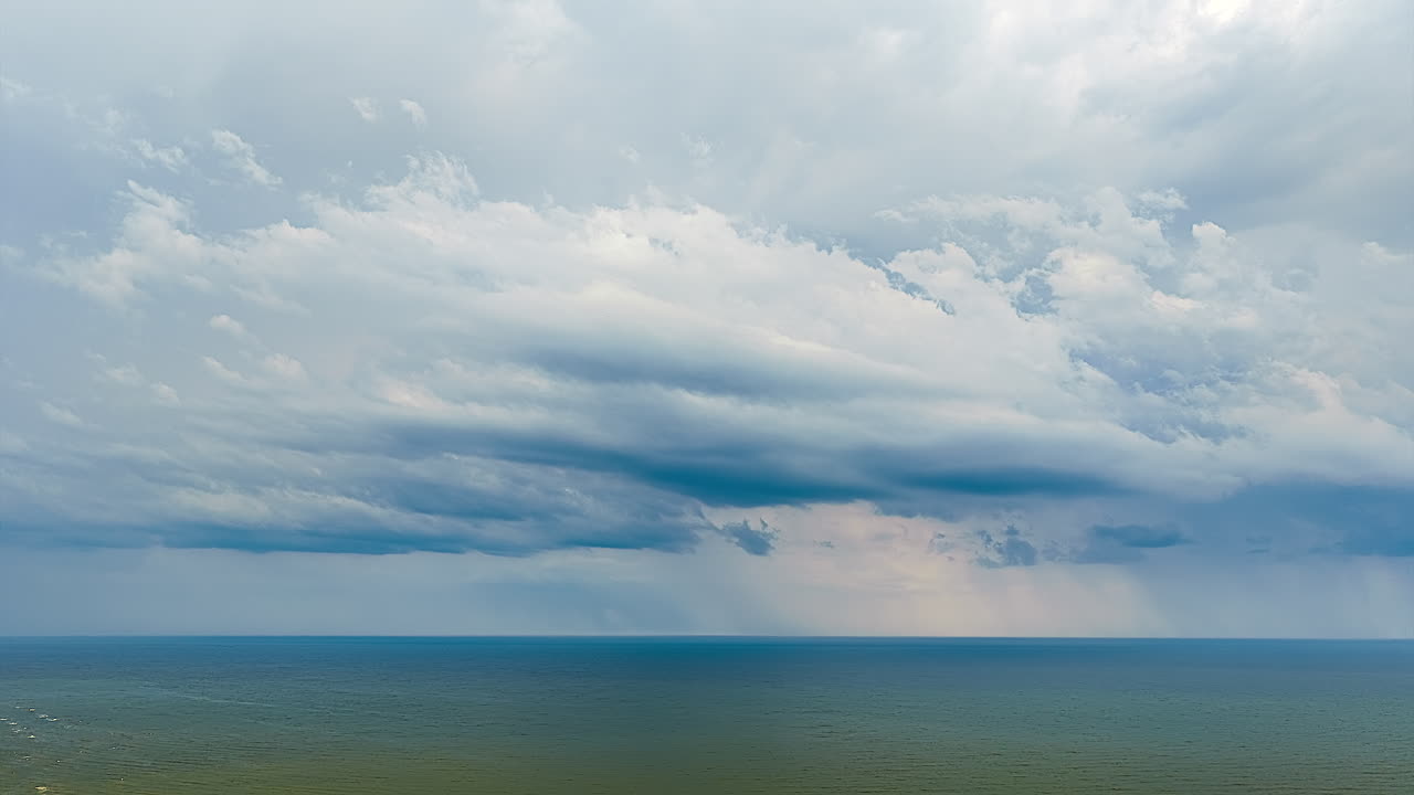Hyperlapse of dramatic clouds over a vast ocean during daytime