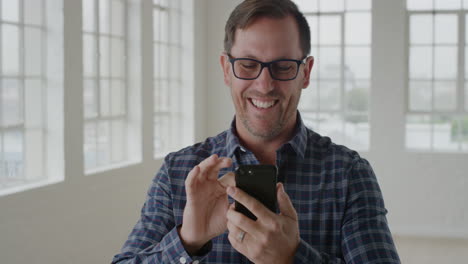 portrait-of-businessman-entrepreneur-using-smartpone-texting-browsing-sending-messages-on-mobile-phone-technology-business-networking-in-office-apartment