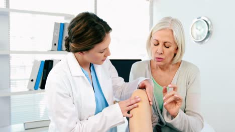 female doctor examining a patient