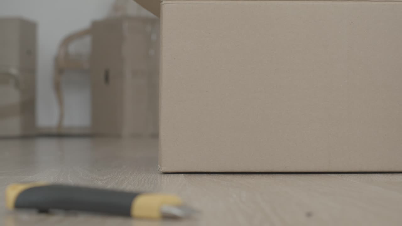 Moving boxes and supplies on floor