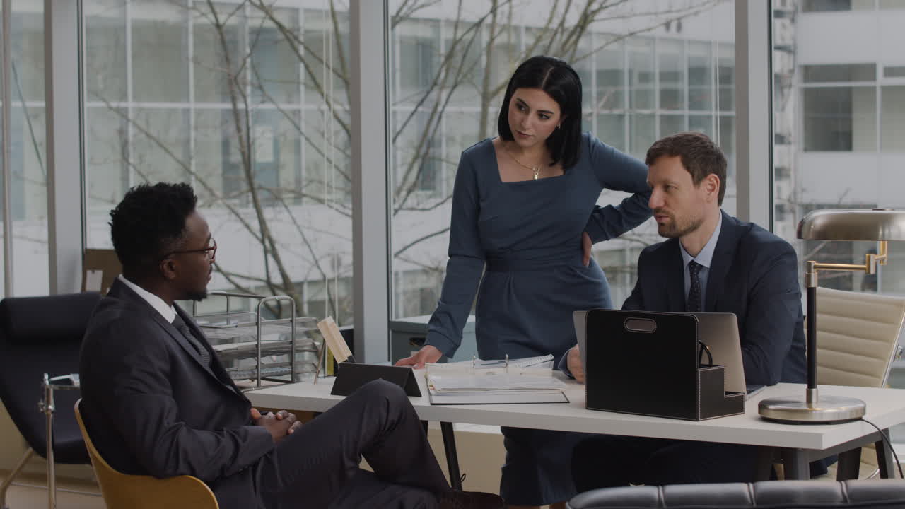 Lawyers talking with client