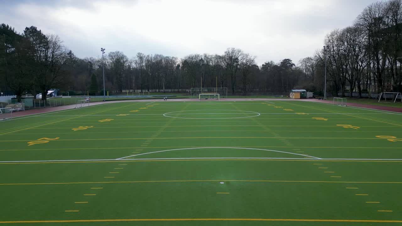 Forward Moving drone shot on a football field on a sunny day.
