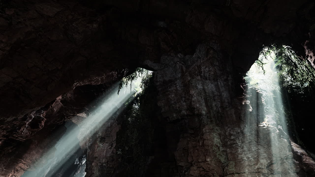 los rayos de sol brillando en una cueva oscura