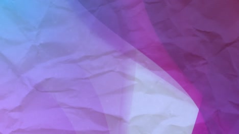 animation of purple and blue circles moving on crumpled white paper