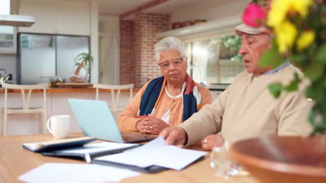 senior couple discussing finances