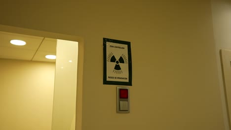 radiation sign warns for hazard area with red alert lamp