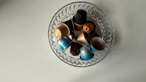 clear glass full of coffee machine capsules seen from above