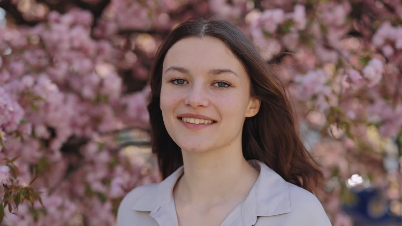 Woman in Springtime Cherry Blossom Trees