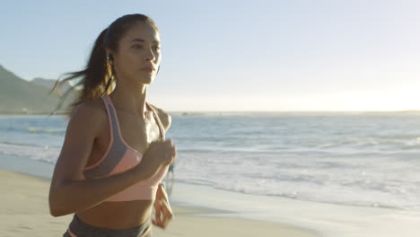 Beach,-running-and-woman-by-the-ocean-for-fitness