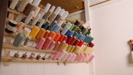 cotton thread spools on wall in seamstress studio