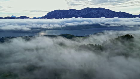 aerial view of an alpine mountain village in clouds, europe