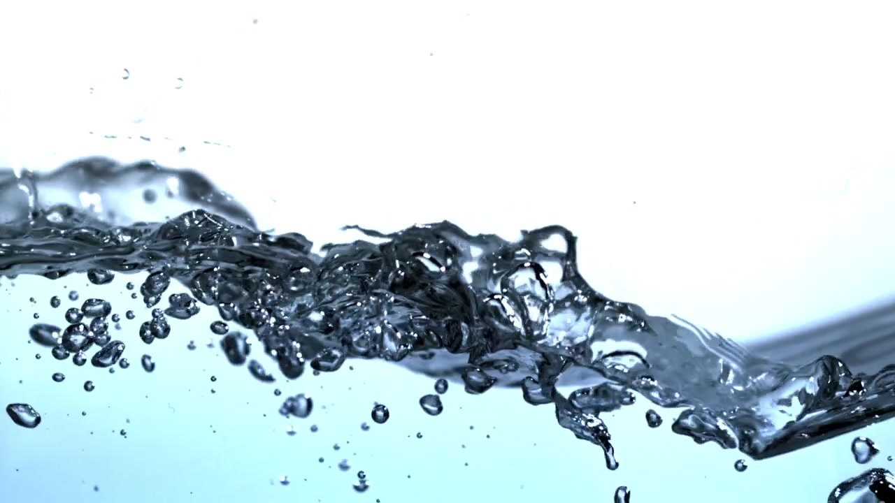 Clear Blue Water Surface with Bubbles and Ripples in Slow Motion
