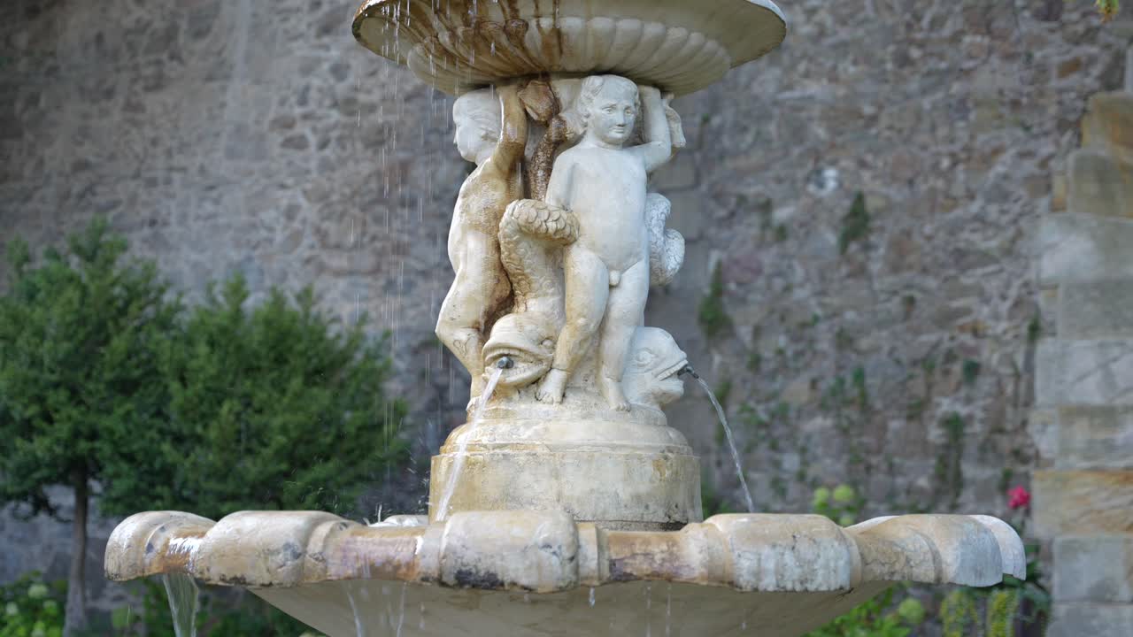 Ornamental fountain and sculpture in Ksiaz Castle gardens, with beautiful detail