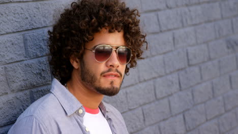 young man having coffee from disposable cup