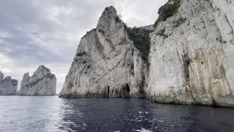 moving reveal of cliff faces off the coast of capri, italy