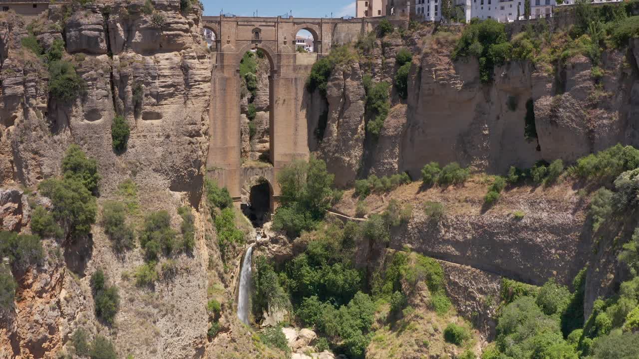 Beautiful Landscape with Waterfall and Bridge in a Canyon