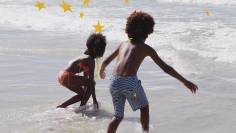 children playing joyfully in ocean waves with star animation overhead