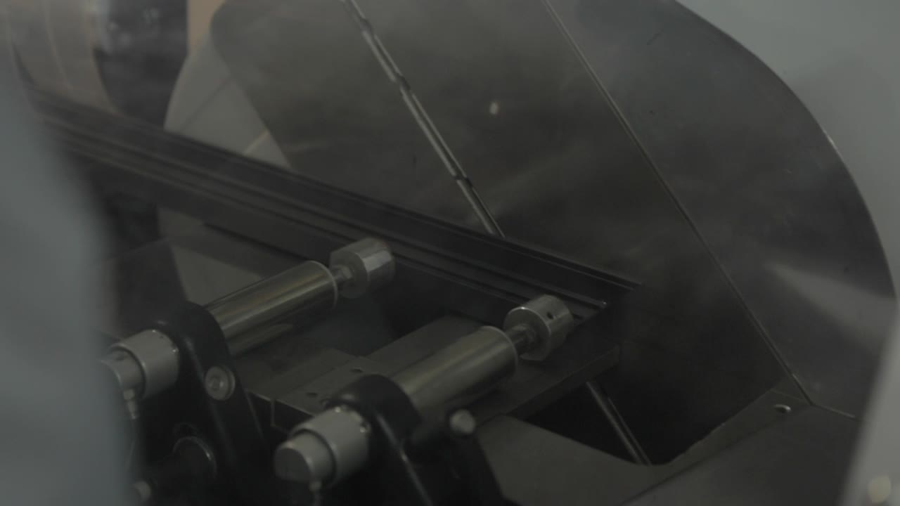 Circular Sawing machine sawing aluminum in a Production of aluminium Windows Workshop. Manufacturing of plastic double-glazed windows. Factory for PVC windows and doors production.
