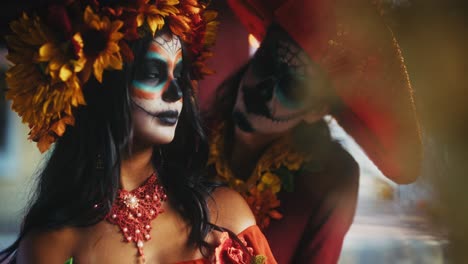 day of the dead couple in traditional costumes