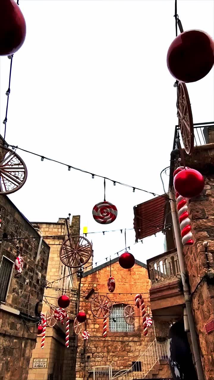 Festive Christmas Decorations Hanging Over an Alley in Old City Jerusalem