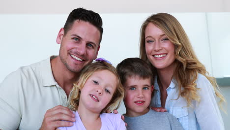 Happy-family-smiling-at-the-camera