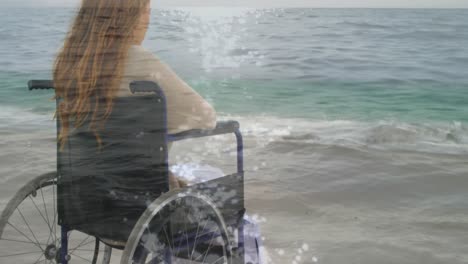 animation of sea landscape over disabled cuacasian woman sitting in wheelchair