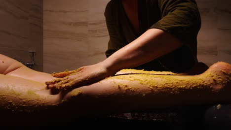 body massage with herbal scrub
