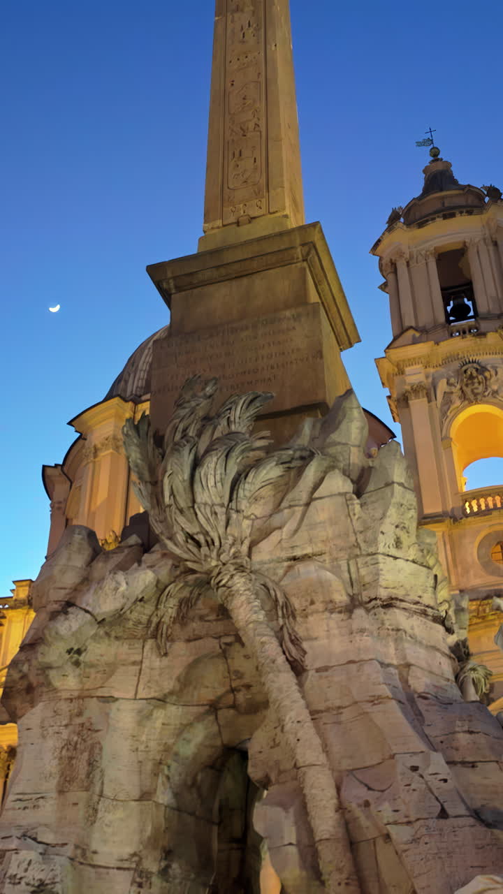 Rome, Italy - February 16, 2024: Fountain of the Four Rivers in the Navona Square at sunset