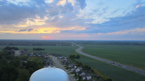 drone-shot-backwards-reavling-the-water-tower-in-Clacksville-neighborhood