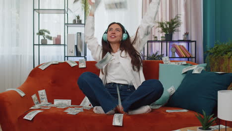 successful happy rich business woman counting money cheering up with high profits, lottery game win