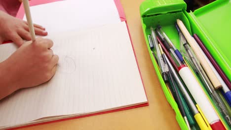 pupil working at her desk