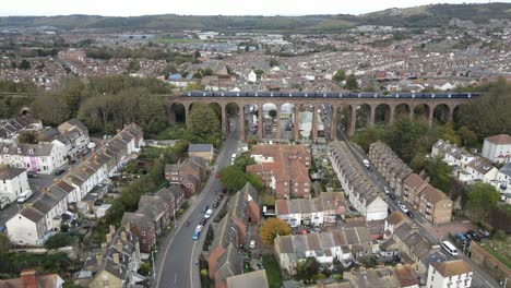 train crossing viaduct on southeastern line folkestone kent uk aerial 4k footage