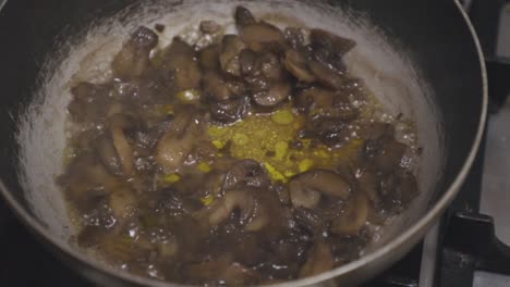 mushrooms cooked in a pan with teriyaki sauce