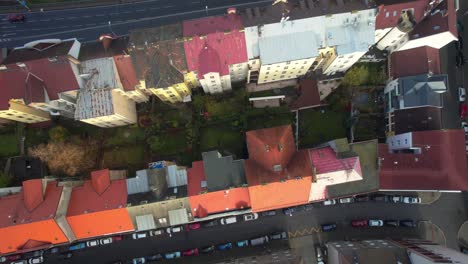 aerial view of a european city with train tracks and colorful buildings