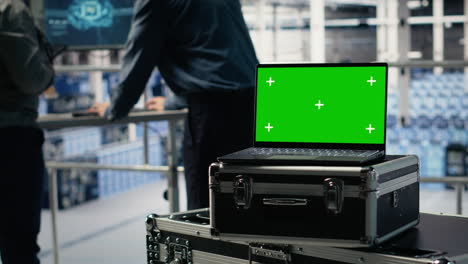 close up of isolated screen laptop in front of data center programmers